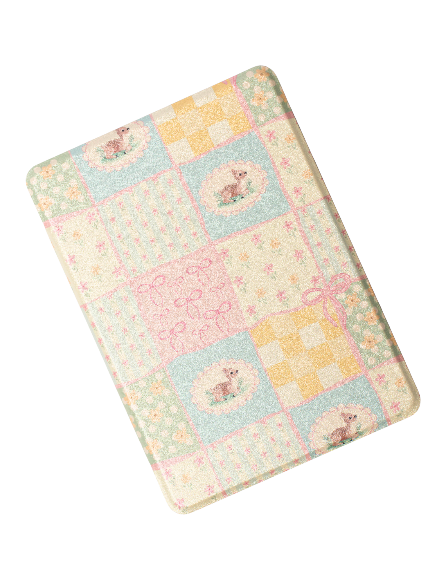 Kindle case with a pastel patchwork print of pink, blue and yellow squares with deer, bows and flowers. Kindle Cover with Vegan Leather. Matchy Kindle cover for 6.8 inch Kindle with plastic back.