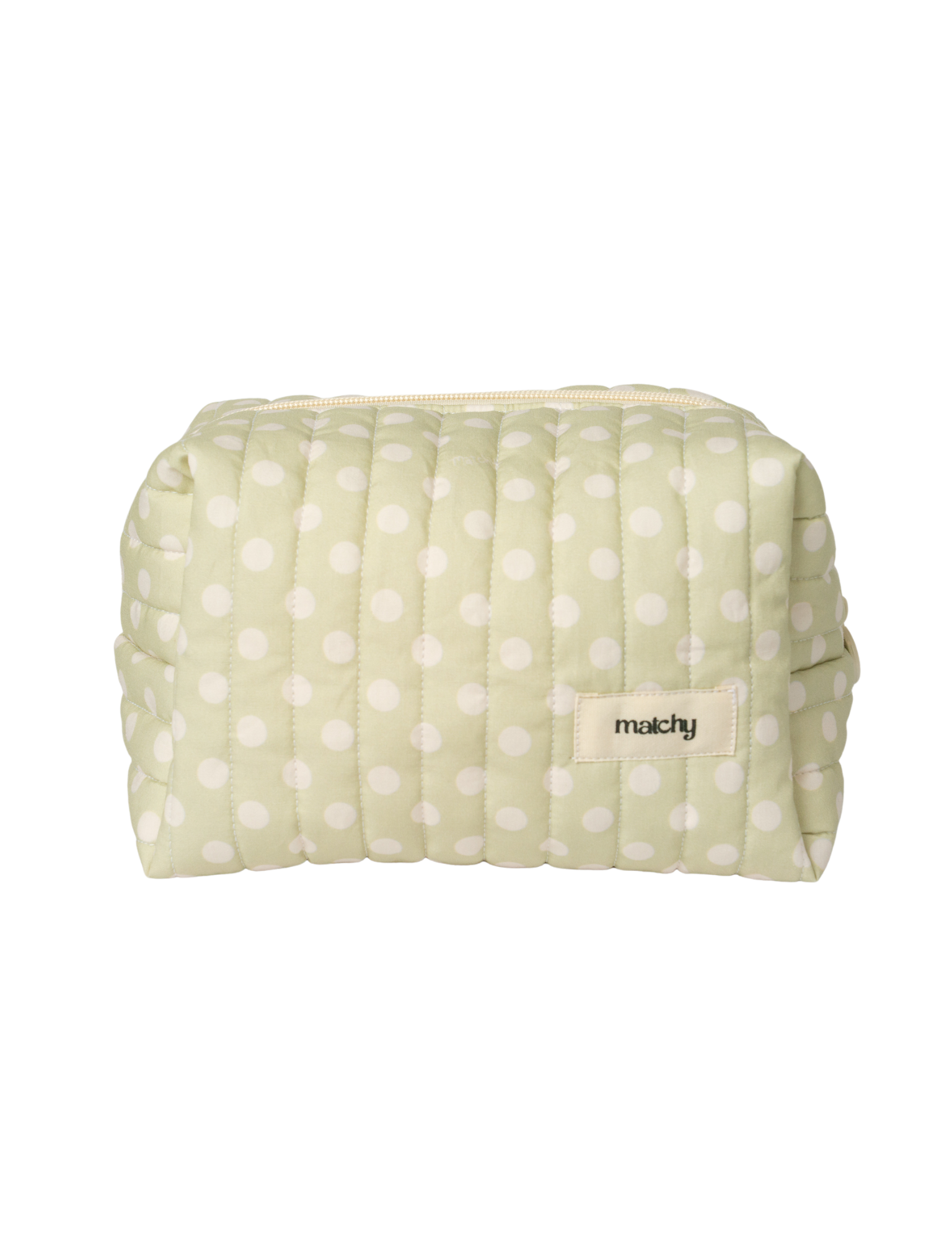 Front view of a sage green quilted carry-all bag with a white polka dot print and a 'matchy' label. Matchy Poppy Carry-All Bag, a quilted makeup and toiletry bag.
