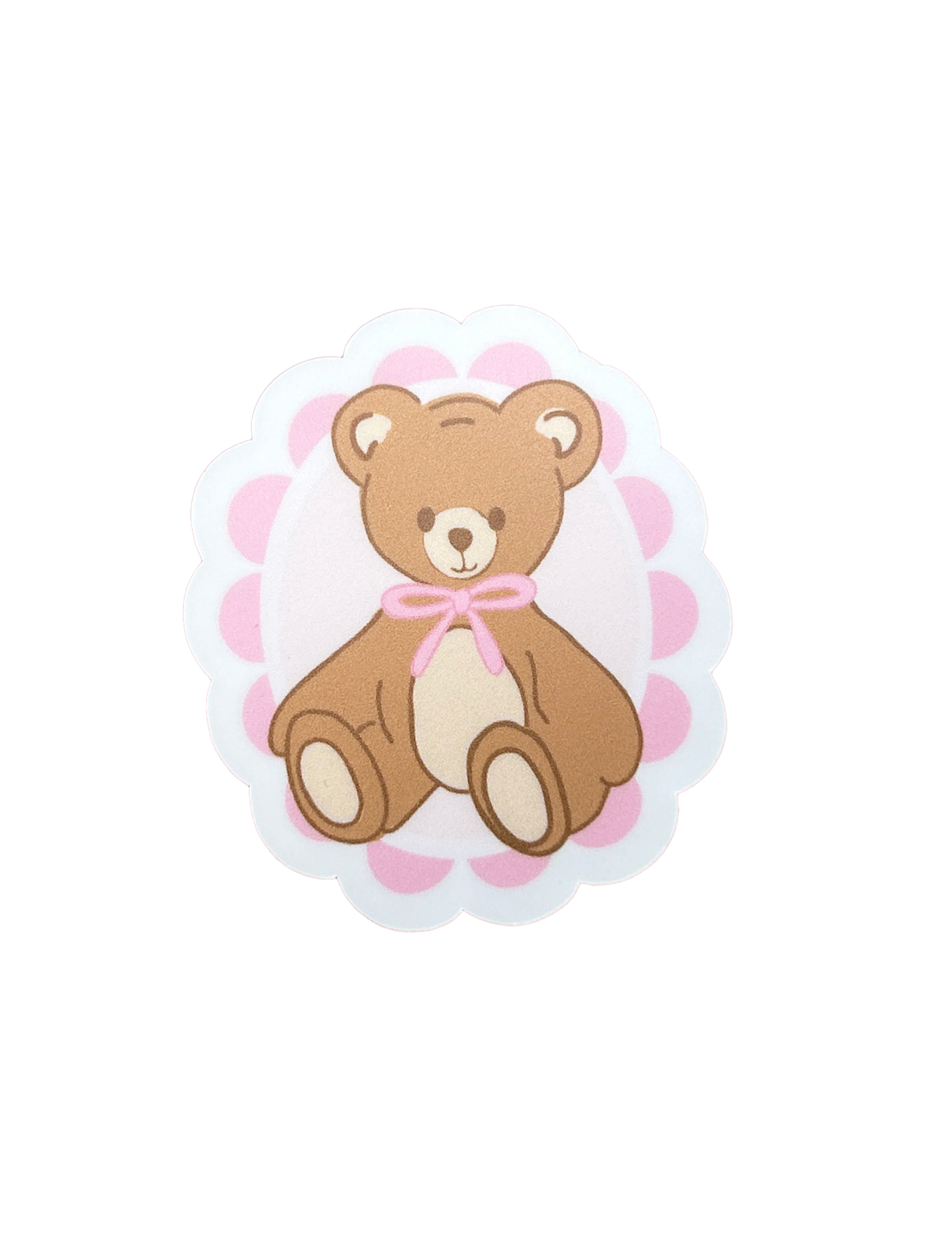 Die cut sticker of a brown teddy bear with a pink bow on a scalloped pink and white background. Matchy Teddy Valentine Sticker.